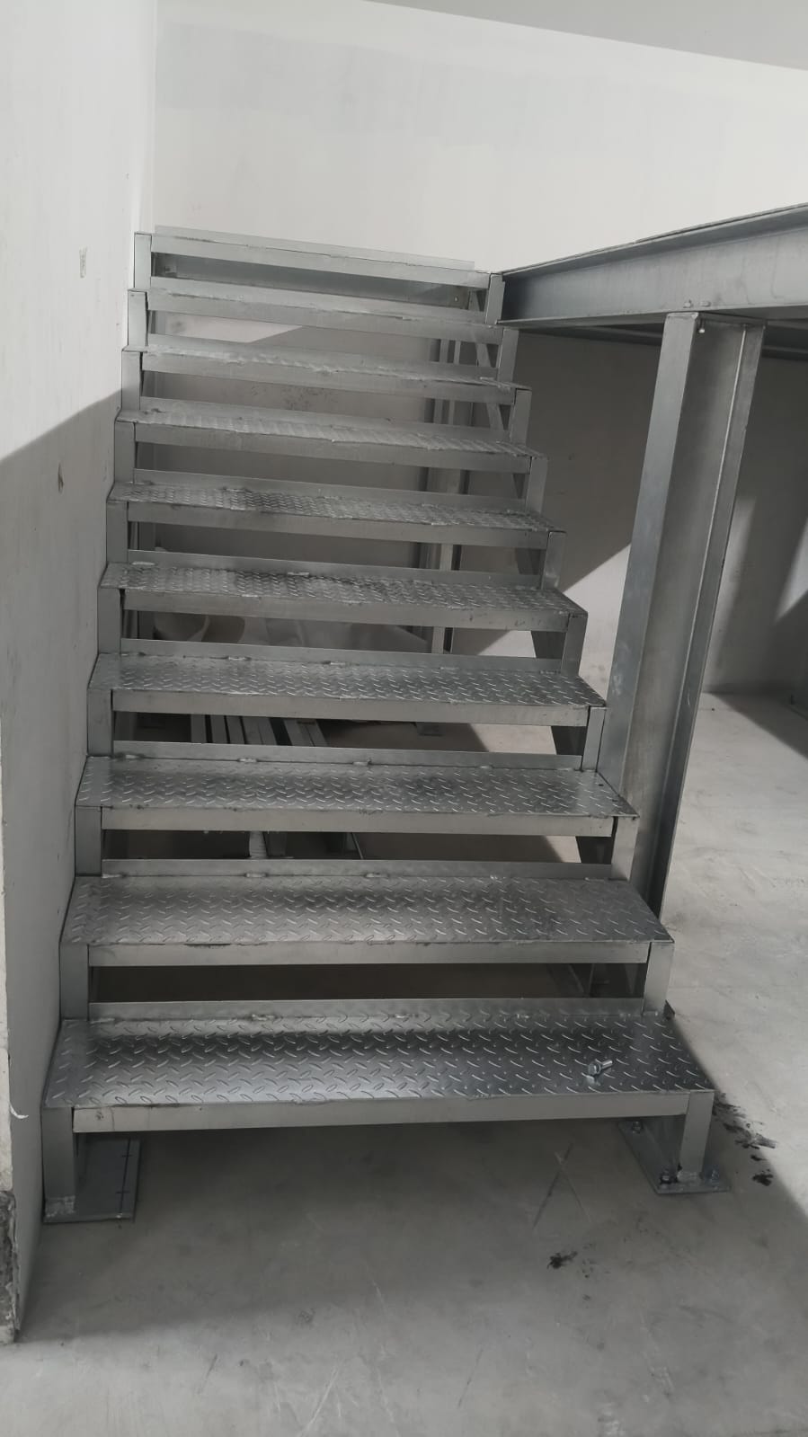 Galvanized access stair tower, walkway grating, and handrails
