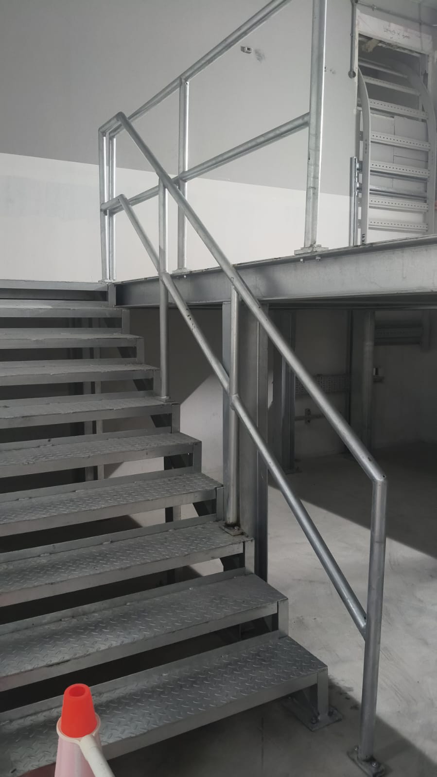 Welded industrial handrails and safety walkways on elevated platform